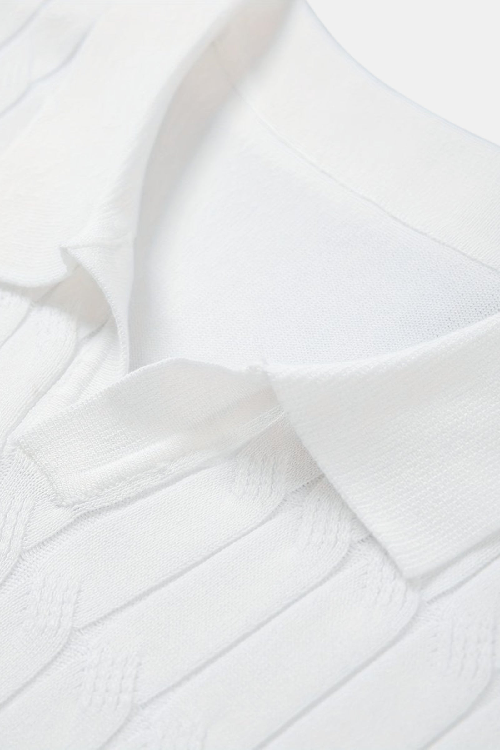 Polo en maille torsadée à col en V de qualité supérieure